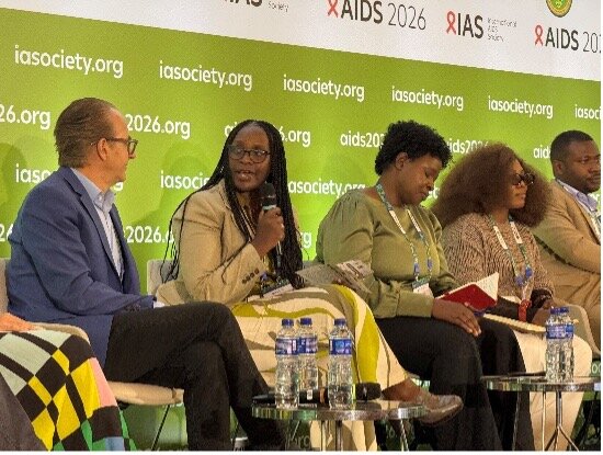Wawira Nyagah speaking into a microphone on a panel at AIDS 2026